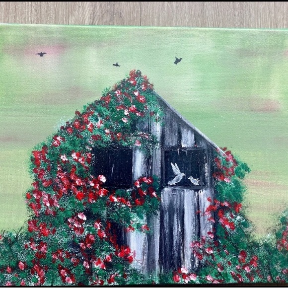 Barn covered with roses painting birds on the window